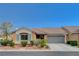 Charming one-story home featuring a well-manicured yard and an attached two-car garage at 5245 Sand Dollar Ave, Las Vegas, NV 89141