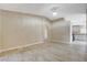 Bright living room boasts tile floors, vaulted ceilings, and a view of the adjacent kitchen at 5245 Sand Dollar Ave, Las Vegas, NV 89141