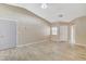 The spacious living room features tile floors, vaulted ceilings, and neutral paint at 5245 Sand Dollar Ave, Las Vegas, NV 89141