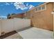 Enclosed patio space with neutral exterior, gravel bed, and fenced perimeter at 5245 Sand Dollar Ave, Las Vegas, NV 89141