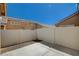 Enclosed outdoor patio area with a white fence, perfect for entertaining at 5245 Sand Dollar Ave, Las Vegas, NV 89141