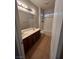Bathroom featuring double sinks, tile flooring, a shower-tub combo, and plenty of natural light at 5937 Armide St, North Las Vegas, NV 89081
