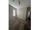 Bedroom featuring neutral carpeting, natural light, and a double door closet for plenty of storage space at 5937 Armide St, North Las Vegas, NV 89081