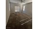 Bedroom featuring natural light, carpet, and private access to a balcony for outdoor relaxation at 5937 Armide St, North Las Vegas, NV 89081