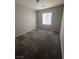 Cozy bedroom with neutral carpet, natural light, and plenty of space for relaxation and personalization at 5937 Armide St, North Las Vegas, NV 89081
