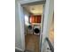 Convenient laundry room includes a washer, dryer, and cabinet storage at 5937 Armide St, North Las Vegas, NV 89081