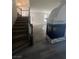Living area with stairs, a hardwood floor, and a fireplace at 5937 Armide St, North Las Vegas, NV 89081