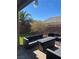 Inviting outdoor patio area with stylish wicker furniture and lush artificial turf at 5937 Armide St, North Las Vegas, NV 89081