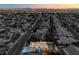 From above see the home, neighborhood, plus a pool, spa, and outdoor lounge area at 6129 Flaming Arrow Rd, North Las Vegas, NV 89031