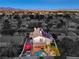 The aerial view showcases the residence, landscaping, pool and outdoor living area at 6129 Flaming Arrow Rd, North Las Vegas, NV 89031