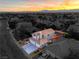 The aerial view showcases the residence, landscaping and a peek into the outdoor living area at 6129 Flaming Arrow Rd, North Las Vegas, NV 89031