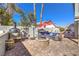 Inviting backyard featuring a fire pit, patio furniture and a barbecue grill at 6129 Flaming Arrow Rd, North Las Vegas, NV 89031