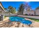 Inviting backyard with a pool, spa and mature landscaping at 6129 Flaming Arrow Rd, North Las Vegas, NV 89031