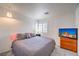 Relaxing bedroom with window and TV at 6129 Flaming Arrow Rd, North Las Vegas, NV 89031