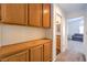 Hallway with built-in cabinets, leading to another room at 6129 Flaming Arrow Rd, North Las Vegas, NV 89031