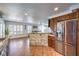 Open concept kitchen with granite countertops, stainless steel appliances, and dining area at 6129 Flaming Arrow Rd, North Las Vegas, NV 89031