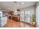 Modern kitchen featuring stainless steel appliances, tile flooring and white shuttered windows at 6129 Flaming Arrow Rd, North Las Vegas, NV 89031