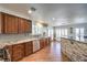 Open kitchen with granite countertops, stainless steel appliances, stone accents and ample cabinet space at 6129 Flaming Arrow Rd, North Las Vegas, NV 89031