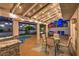 Inviting covered patio featuring a built-in grill, comfortable seating, and a fire pit near the pool and spa at 6129 Flaming Arrow Rd, North Las Vegas, NV 89031