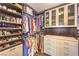 Custom walk-in closet with ample shelving and drawers for organized storage at 6129 Flaming Arrow Rd, North Las Vegas, NV 89031