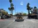 Image shows community gate with trees and a light blue sky in the background at 6250 W Flamingo Rd # 143, Las Vegas, NV 89103
