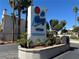 La Mirage condominiums sign with palm trees against a bright blue sky at 6250 W Flamingo Rd # 143, Las Vegas, NV 89103