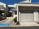 Condo with attached garage and stairs to the second-floor unit; parking space is clearly marked at 6250 W Flamingo Rd # 143, Las Vegas, NV 89103