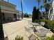 Community pool area with seating, tables, and a view of the pool and nearby condos under a sunny sky at 6250 W Flamingo Rd # 143, Las Vegas, NV 89103