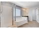 Bright bathroom featuring a shower, a soaking tub, and a window at 6656 Fort William St, North Las Vegas, NV 89084
