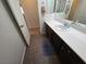 Bright bathroom with dark cabinets and a blue rug at 6656 Fort William St, North Las Vegas, NV 89084