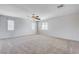 Spacious bedroom with carpet, a ceiling fan, and windows for natural light at 6656 Fort William St, North Las Vegas, NV 89084