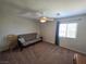 Bedroom featuring a large window and ceiling fan at 6656 Fort William St, North Las Vegas, NV 89084