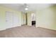 Bedroom view featuring a ceiling fan, carpet, and closet at 6656 Fort William St, North Las Vegas, NV 89084