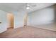 Bedroom featuring carpet, white walls, ceiling fan, and doors at 6656 Fort William St, North Las Vegas, NV 89084
