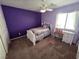 Bedroom with a bed, desk, and fan with great natural light at 6656 Fort William St, North Las Vegas, NV 89084