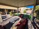 Cozy covered patio featuring a brick floor, comfortable seating, and a view of the well-manicured backyard at 6656 Fort William St, North Las Vegas, NV 89084