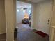 Inviting entryway with tile flooring that transitions to carpet in the adjacent living area at 6656 Fort William St, North Las Vegas, NV 89084