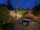 Cozy backyard firepit seating area with a brick paver patio at 6656 Fort William St, North Las Vegas, NV 89084