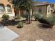 Low maintenance landscaping features bark and a variety of desert plantings at 6656 Fort William St, North Las Vegas, NV 89084