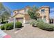 Two story home with a manicured front yard featuring desert landscaping and a real estate sign at 6656 Fort William St, North Las Vegas, NV 89084