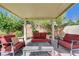 Covered gazebo area features outdoor seating and a brick paver floor, providing a comfortable area for relaxing outdoors at 6656 Fort William St, North Las Vegas, NV 89084