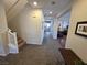Hallway featuring tile flooring and staircase leading to the upper level at 6656 Fort William St, North Las Vegas, NV 89084