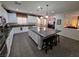 Kitchen featuring white cabinets, granite countertops, stainless steel appliances and large kitchen island at 6656 Fort William St, North Las Vegas, NV 89084