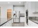 Kitchen featuring stainless steel appliances, an island, and built-in oven at 6656 Fort William St, North Las Vegas, NV 89084