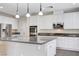Modern kitchen with stainless steel appliances and a center island at 6656 Fort William St, North Las Vegas, NV 89084