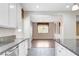Kitchen view with stainless steel dishwasher and granite countertops at 6656 Fort William St, North Las Vegas, NV 89084