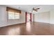 Bright, spacious living room with hardwood floors, large windows, and sliding glass doors at 6656 Fort William St, North Las Vegas, NV 89084