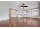 Spacious living room with hardwood floors and a ceiling fan at 6656 Fort William St, North Las Vegas, NV 89084