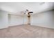 Large carpeted loft offering versatile living space with neutral walls at 6656 Fort William St, North Las Vegas, NV 89084