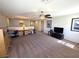 Large loft space with carpet flooring, a ceiling fan, and built in desk at 6656 Fort William St, North Las Vegas, NV 89084